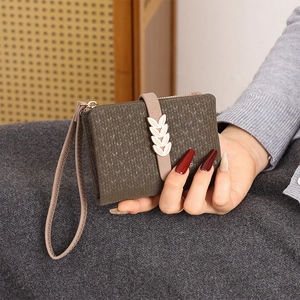 Olive green knitted texture bifold wallet with leaf metal clasp and wrist strap