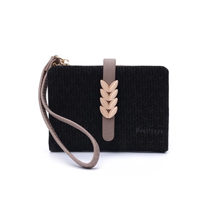 Detail of black woven texture wallet with grey buckle strap and golden leaf fastener