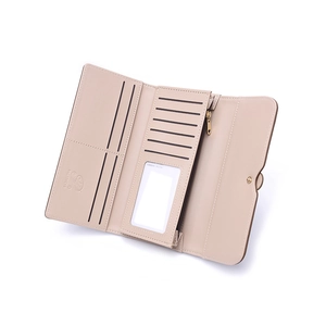 Interior detail of a pink long trifold wallet showing card slots and zipper pocket
