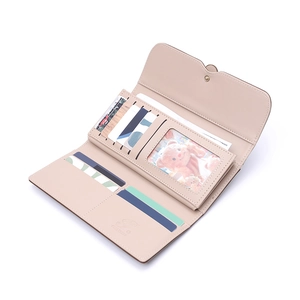 Women's pink long trifold wallet featuring multiple card slots and a clear ID window