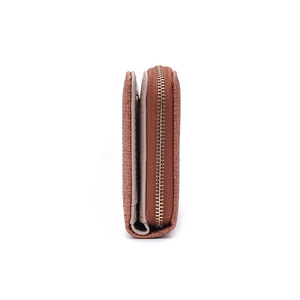 Detail view of caramel brown woven leather wallet showing golden zipper and thick structure