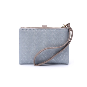 Detail of greyish-blue textured leather wallet with secure zipper and wrist strap