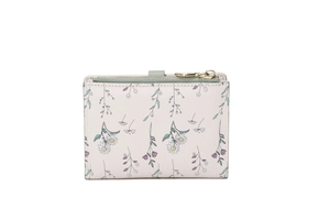 Detail of floral women's short wallet showing daisy patterns and green magnetic buckle