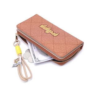 Quilted tan leather long wallet with wristlet strap and metallic zipper closure