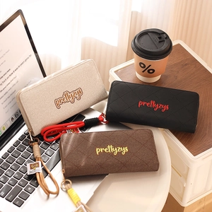 Three minimalist woven texture long wallets in beige, black, and brown with wrist straps