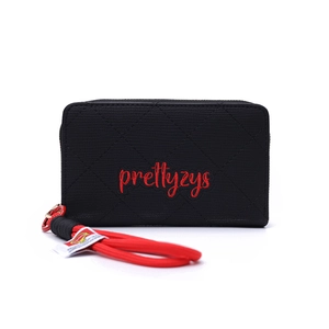 Detail of black quilted texture wallet with red wrist strap and brand embroidery