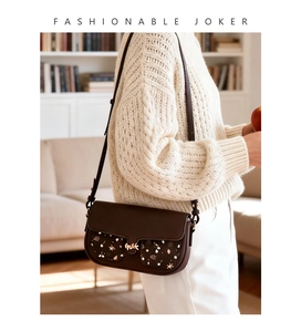 Fashionable dark brown crossbody bag with star print and gold branch buckle detail