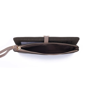 Detail of short leather wallet with litchi texture, zipper pocket, and card slots