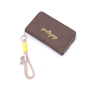 Detail of dark brown lattice quilted wallet featuring a logo and woven wrist strap