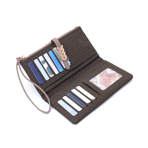 Detail view of brown textured wallet interior with card slots, coin pocket and ID window
