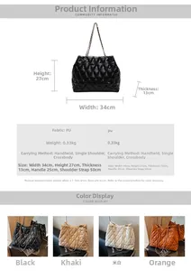 Detail view of black quilted faux leather tote with metal chain strap and dimensions