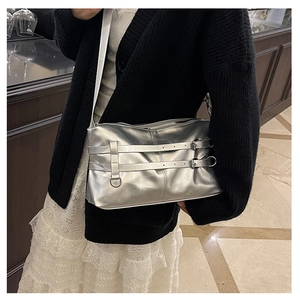 Metallic silver patent leather tote bag with adjustable strap and decorative buckles
