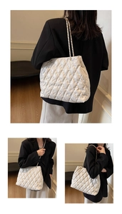 Three-way view of white quilted tote bag with chain strap and large capacity