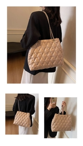 Detail of beige quilted tote bag with chain strap and elegant diamond lattice texture