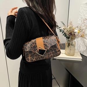Chic leopard print underarm bag with square metal buckle shown on a model