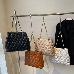 Chic quilted tote bag with chain strap in black, orange, apricot and white colors