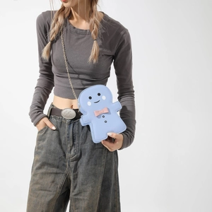 Sac bandoulière bonhomme pain d'épices bleu avec nœud rose et chaîne dorée