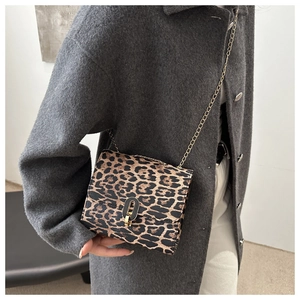 Leopard print chain crossbody bag styled with a grey wool coat for a chic autumn look