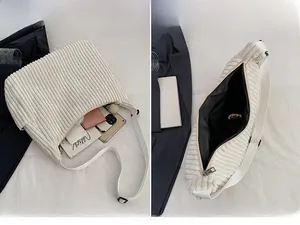 Detail of cream corduroy tote bag showing large interior capacity and internal pockets
