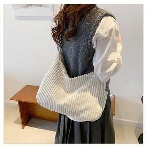 Large white corduroy hobo bag for women with minimalist shoulder strap for daily commuting