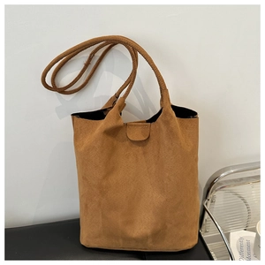 Classic camel suede bucket bag with long shoulder strap and magnetic closure