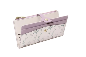 Detail view of long floral wallet with lilac clasp showing multi-card slots and zip pocket