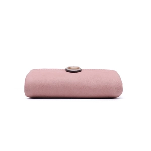Detail view of pink PU leather wallet showing lychee grain texture and metal snap button