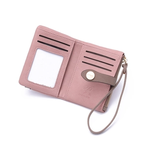 Detail view of pink PU leather wallet with multiple card slots and zipper pocket