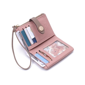 Detail view of pink fold wallet with card slots, coin pocket and a golden metal buckle