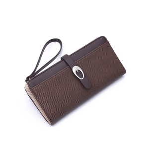 Detailed view of long brown PU leather wallet with textured stripes and silver metal buckle