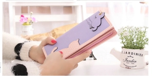 Close-up of light purple and pink PU leather wallet featuring cute cat patterns and charm