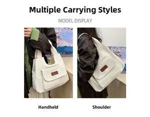Vue double d'un grand sac fourre-tout blanc en nylon montrant les styles main et épaule