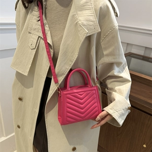 Fashionable magenta quilted mini crossbody bag for women with elegant gold metal hardware