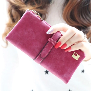 Detail of a deep rose pink frosted leather long wallet with buckle strap and zipper