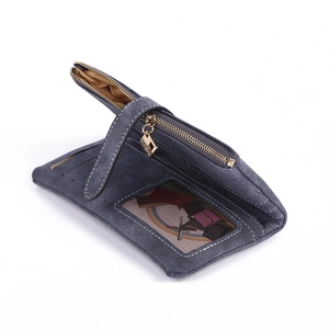 Detailed interior of matte leather wallet showing card slots and zipper pocket