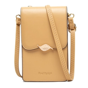 Detailed view of pale yellow leather phone bag with golden leaf clasp and brand logo