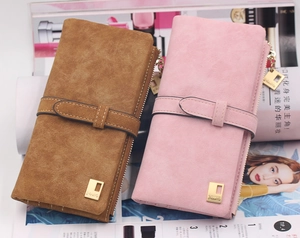 Detail of matte finish women's long wallets in brown and pink with golden metal logo