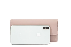 Pink PU leather long wallet shown with a white iPhone for size reference and scale