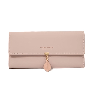 Detail of dusty pink PU leather long wallet with leaf pendant and stitched text