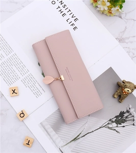 Detailed view of women long trifold PU leather wallet with delicate leaf pendant ornament