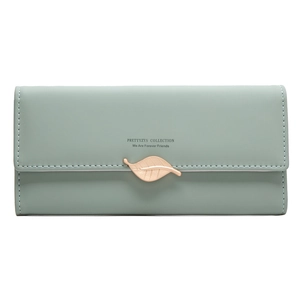 Detail of mint green tri-fold long wallet with gold leaf pendant and brand lettering