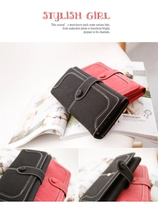 Detail of vintage long wallet showing lychee texture leather and contrast stitching