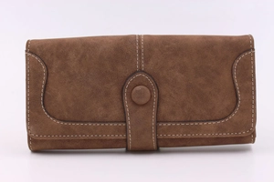 Close-up of vintage brown suede long wallet featuring contrast double stitching details