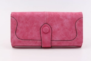 Detail of rose pink long wallet featuring white stitching and snap button closure