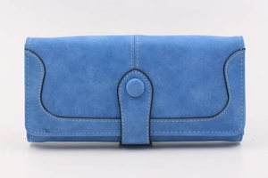 Detail view of bright blue suede wallet with contrast stitching and snap button closure
