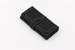 Side view of long vintage black wallet showing multi-layer gusset and white stitching