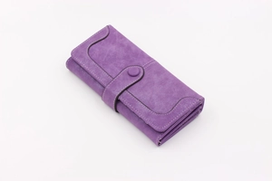 Detail of purple long wallet featuring white contrast stitching and round snap button