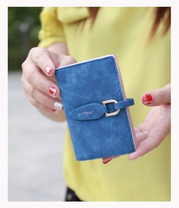 Detail of blue frosted leaf buckle folding card holder with golden metal U-clasp
