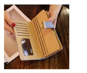 Detail view of light blue leather wallet interior with multiple card slots and photo window