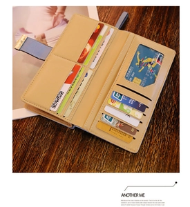 Detail view of the multi-slot interior and ID window of this long faux leather wallet